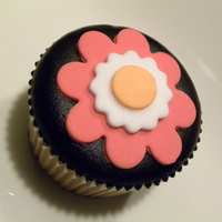 Poured Fondant Cupcake This was my first attempt at using poured fondant. Just learned about it today...did some research and made these cupcakes tonight. TFL...