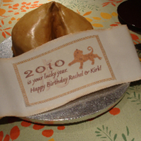 Fortune Cookie Cake I wish I had a better photo of this. I made a white cake and covered it with tan colored chocopan, brushing it with various luster dust...