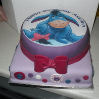 Eeyore Cake Made this cake for my bf's sister that loves Eeyore. The top cake is coconut with pineapple filling, the bottom is banana cake with...