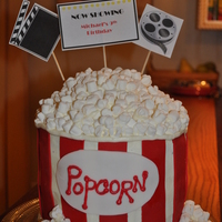 Popcorn Tub Cake I made this cake for my son's 9th Birthday. he wanted a Movie Party and this cake was perfect. It is a double layer cake covered in...