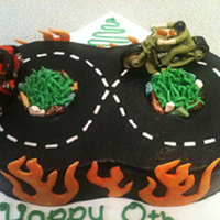Motorcycle Cake 8 yr old birthday cake. he likes motorcycles. 6" rounds with buttercream and fondant. Candy rocks.