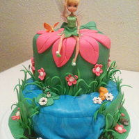 Tinkerbell Cake With Waterfall This is a 8" round bottom with a 6" top. Covered with fondant than Dazzled with fondant decor. Tinkerbell was real doll.
