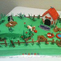 Dog Yard Bull Dogs in Yard with Dog House, Grass, and Flowers