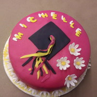 Hot Pink Daisy Graduation Cake This was a hot pink, triple chocolate, all fondant cake with daisies.