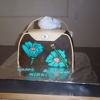 Brown/ Turquoise Handbag vanilla cake with chocolate buttercream frosting, buttercream flowers, fondant/gumpaste accents