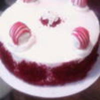 Red Velvet Cake 8" round - layered red velvet cake w/cream cheese icing & red velvet truffles on top