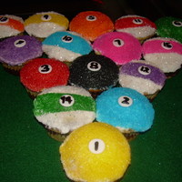 Pool Ball Cupcakes Pool anyone?All decorated with colored sugar. Fondant circle, black decorating icing for the numbers.