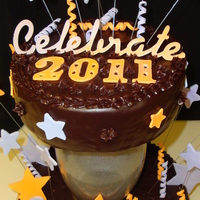 Shoot For The Stars In 2011! Happy New Year! Chocolate ganache and caramel frosting make this cake one to remember! I used my new cricut cake for the font and the stars. The gumpaste...