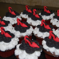 Fashionista Cupcakes! Chocolate cupcakes with buttercream frosting, hand sculpted each high heel out of gumpaste/fondant. Black flower base is fondant too. TFL...