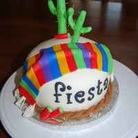 Fiesta Party Cake White cake, white buttercream frosting, covered in fondant, fondant accents.