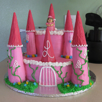Pink Princess Strawberry cake with strawberry glaze filling. Buttercream icing. Turrets are made of rice krispie treats covered in buttercream and...