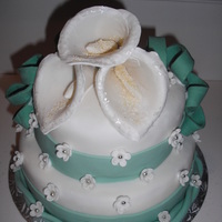 My First Cake cake decorating class, it was my first time covering a cake in fondant. I made calla lilies out of gumpaste. The cake was carrot cake with...