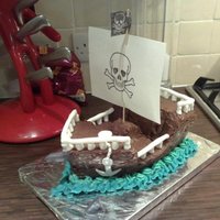 Pirate Ship Cake! I made this for my brother's birthday in 2009 at his request. It was a lemon madeira style cake inside with a chocolate ganache...