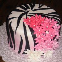 Pink Fading Flowers With Zebra Pink fading flowers with zebra print. I sprayed the bottom half of the cake with edible pink spray to give it a different effect