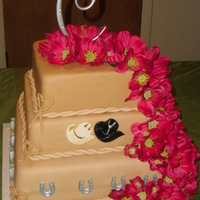 Western Wedding Vanilla, Red velvet and chocolate tiers. Flowers are not edible. The horseshoes are chocolate sprayed with edible silver. I drew out a...