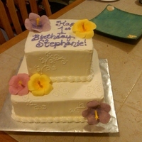 Hawaiian 1St Birthday Vanilla cake with buttercream filling on bottom and pineapple filling on top. My first attempt at gumpaste hibiscus. It was late and my...