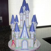 Castle Cake For Hannah's Princess Party Castle cake for my niece's Princess themed 4th bday party. The tower peaks are covered in MMF and edible sparkles. The purple accents...