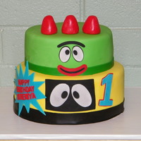 Yo Gabba Gabba This is a 10 inch with an 8 inch cake on top. The covering is MMF, and the other decorations are wilton fondant cut with a cricut cake. A...
