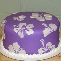 Hibiscus Cake 10 inch double layer cake. The purple is MMF. The white flowers are made from wilton fondant and cut with a cricut cake using Make the Cut...