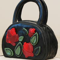 Black Handbag With Rose Detail Made around the time of our Race Carnival days. It seemed the perfect accessory to eat. Black fondant and aplique fondant cut outs to...
