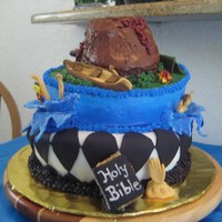 Topsy Turvey Cake my 1st attempt with a topsy turvey cake. The cake represents my son's senior year All done with fondant & butercream.