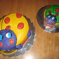 Ladybugs My granddaughter's 1st b'day cakes (1 for her & the other for the guest). The large one was done w/ a Wilton pan & small...