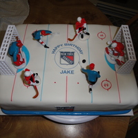 Happy Birthday Jake! Yellow cake with chocolate pudding filling and iced in chocolate buttercream. Covered in fondant, center ice is an edible image & store...