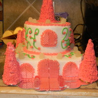 Castle This cake was for my cousins lil girl. My 1st castle cake. I used s 8in square for the bottom and a 6in round for the top. I hand piped the...