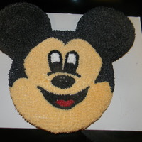 Mickey Mouse This cake was alot of fun to make. I used a 10in and 2 6in cakes to make the head and ears. I was going to cover it in fondant, but i...