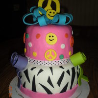 Peace Girly Cake was asked to make girly cake with bright colors and peace signs
