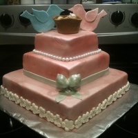 Love Birds Mom to be wanted Love birds shower cake so I put the baby in the nest with the love birds. Covered in MMF. Airbrushed pearl and pink mixed...