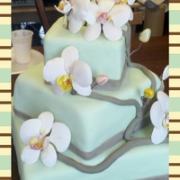 Butterfly Orchids Three tier cake coverd in fondant. Gumpaste buterfly orchids and buds that I made. For the first time also the first square tier cake.