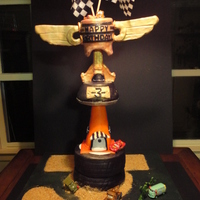 3Rd Birthday Piston Cup Cake A very much Cars inspired 3rd birthday cake for my step-son. Tallest cake I have made (It was close to 3ft tall" and my first time...