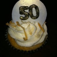 50Th Birthday Cupcakes Coconut cupcakes with a chocolate ganache filling and a coconut buttercream and toasted coconut. The decorations are white chocolate...