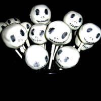 Jack Skellington Cake Pops Spice cake and cream cheese frosting cake pops dipped in white chocolate. Faces were drawn on with food writers.