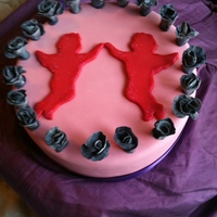 Kitsch Cupid Valentine's cake with sugar roses