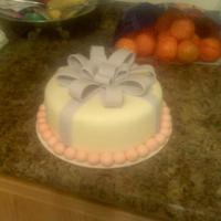 Simple Bow Cake This is my first fondant covered cake and first bow. I really want to get better at making the bows.. had a little trouble with that..