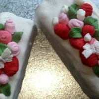 My First Attempt At Cake Decorating basic butter-cream filled cake which i covered with fondant and decorated with fabric style roses and butterflies