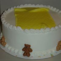 Baby_Shower_10-08-05.jpg Butter cream frosting on French Vanilla cake, 2 layer 10 inch. The little bears are made from fondant. The blanket from fondant. The...
