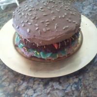 Hamburger Cake Buttercream frosting, sunflower seeds, cake crumbs for burger and sourpatch kids for lettuce.