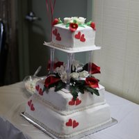 40Th Anniversary Cake This is a 3 tier in BC, with fondant roses, calla lillies and hearts, the middle boquet is silk flowers.