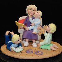 Just One More Story Please Grandma! A cake for a lady's 60th birthday featuring her as usual reading to her 3 grandsons. She loves wearing her favourite purple knitted...