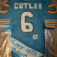 Chicago Bears Jersey Cake This cake was done for a 10yr old girls birthday, she loved the chicago bears and her favorite player was cutler. To make it more girlie I...