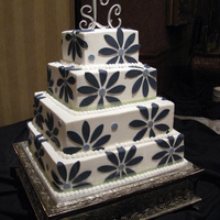 Daisy Cake Buttercream iced with fondant petals, inspiration from the knot.com.