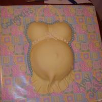 Pregnant Belly -Yellow My first belly cake, also my first time using fondant. Belly is a large Pyrex bowl, breast are from a "breast" pan. BC accents