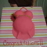 Pink Belly Baby shower was done in bright green and hot pink. I used a large Pyrex bowl for the belly. fondant with buttercream accents