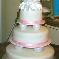 Simple Elegance My first wedding cake. It was for my sister-in-law and she wanted something real simple. White scratch cake with buttercream made from...