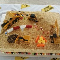 Construction Cake The "dirt hill" is cake. The cake is covered with crushed vanilla wafers...it adds a very yummy flavor as well as the dirt look....