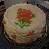 Rosette Bouquets This is my first two teired cake, with chocolate pudding filling. Buttercream frosting and a basketweave trimmin g! I hope u like it, I did...