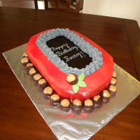 Ohio State Buckeye Cake Chocolate cake with peanut butter filling. Chocolate fudge glaze in the center with buttercream frosting!